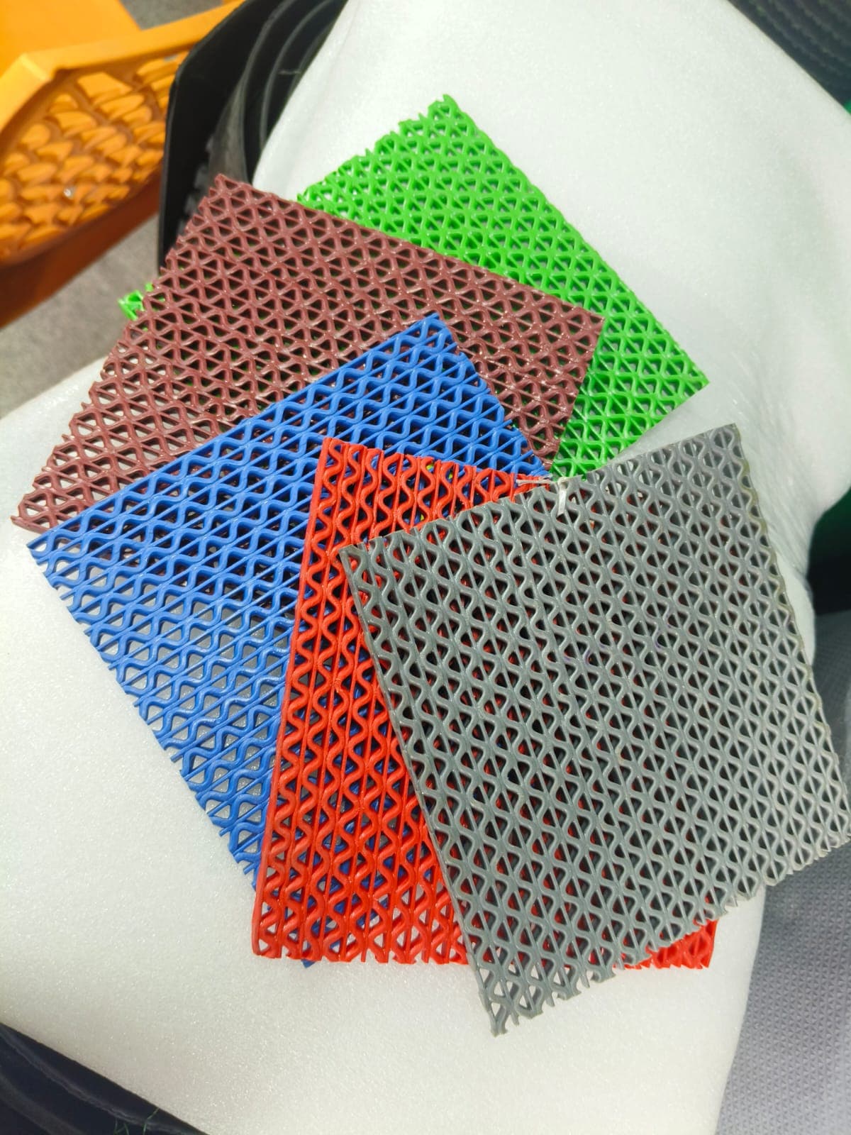 Entrance mat showcase with open grid PVC mat colours